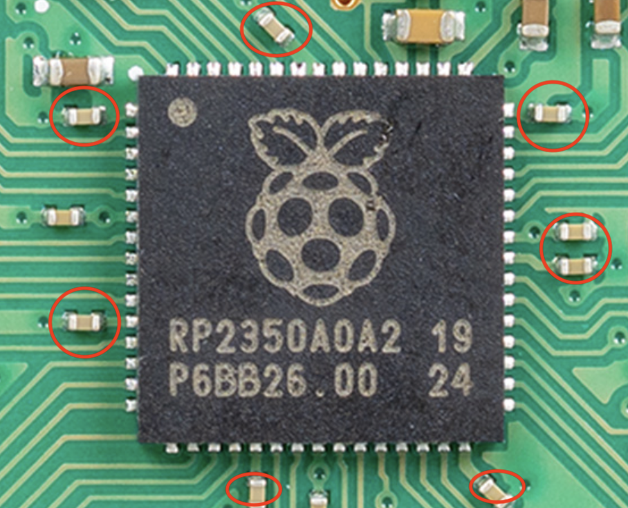 RP2350 chip of the challenge, and surrounding parts.